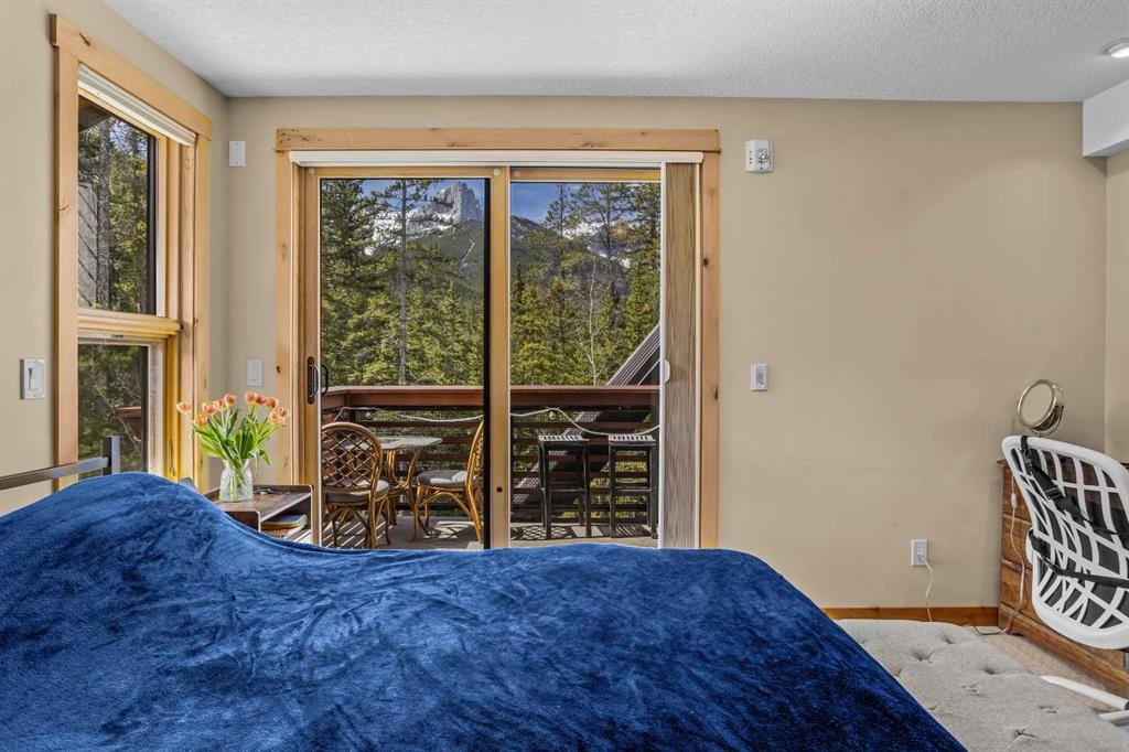 302-2100A Stewart Creek Drive, Canmore, AB - Indoor Photo Showing Bedroom