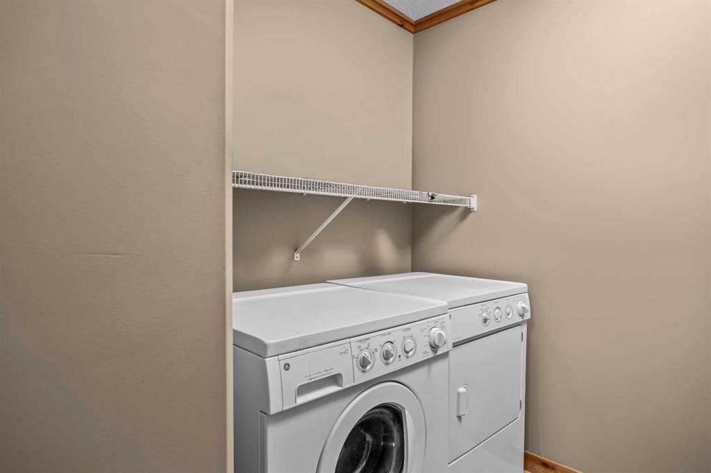 302-2100A Stewart Creek Drive, Canmore, AB - Indoor Photo Showing Laundry Room