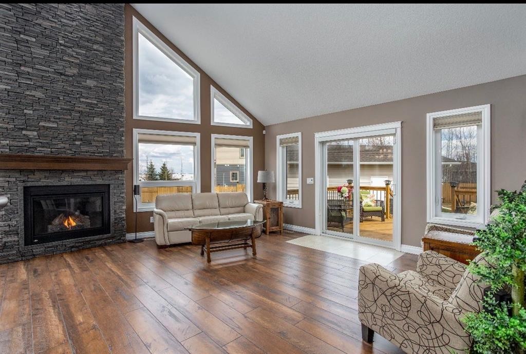 # 219 162 Peace River Avenue, Joussard, AB - Indoor Photo Showing Living Room With Fireplace
