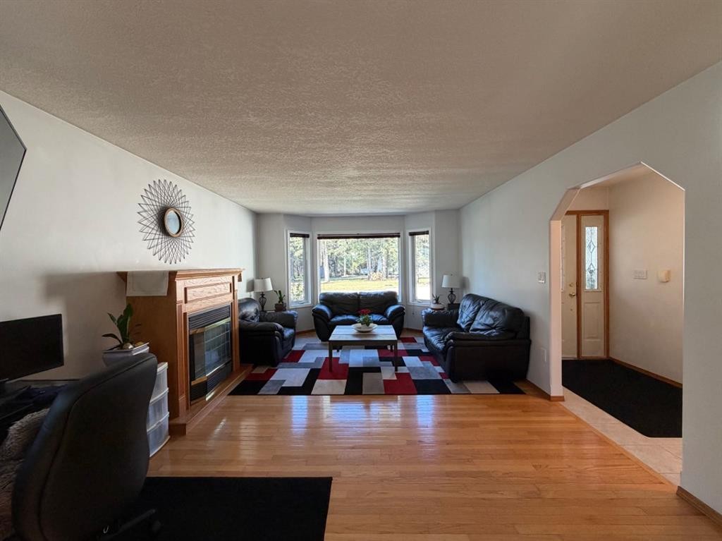 53404A Highway 748 E, Rural Yellowhead County, AB - Indoor Photo Showing Living Room With Fireplace
