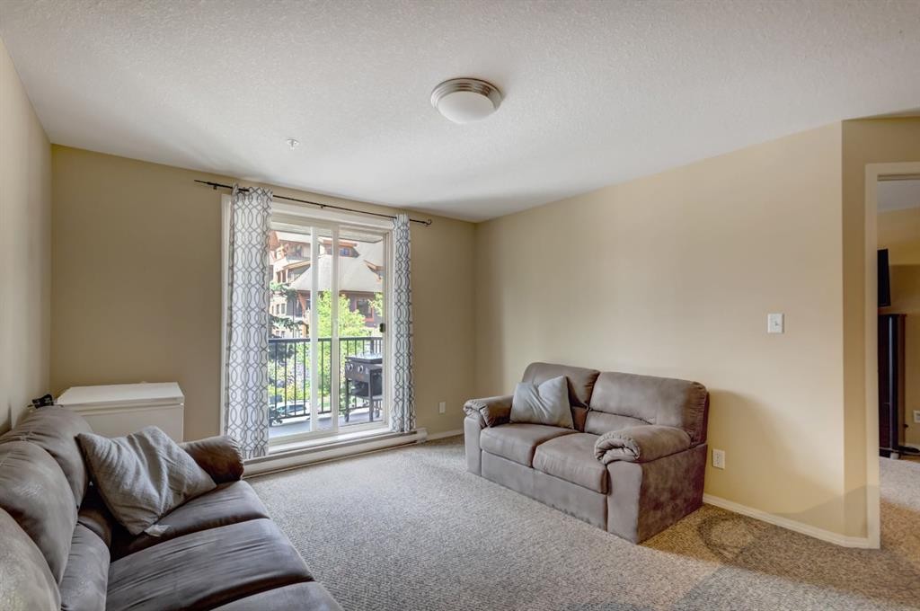202-186 Kananaskis Way, Canmore, AB - Indoor Photo Showing Living Room