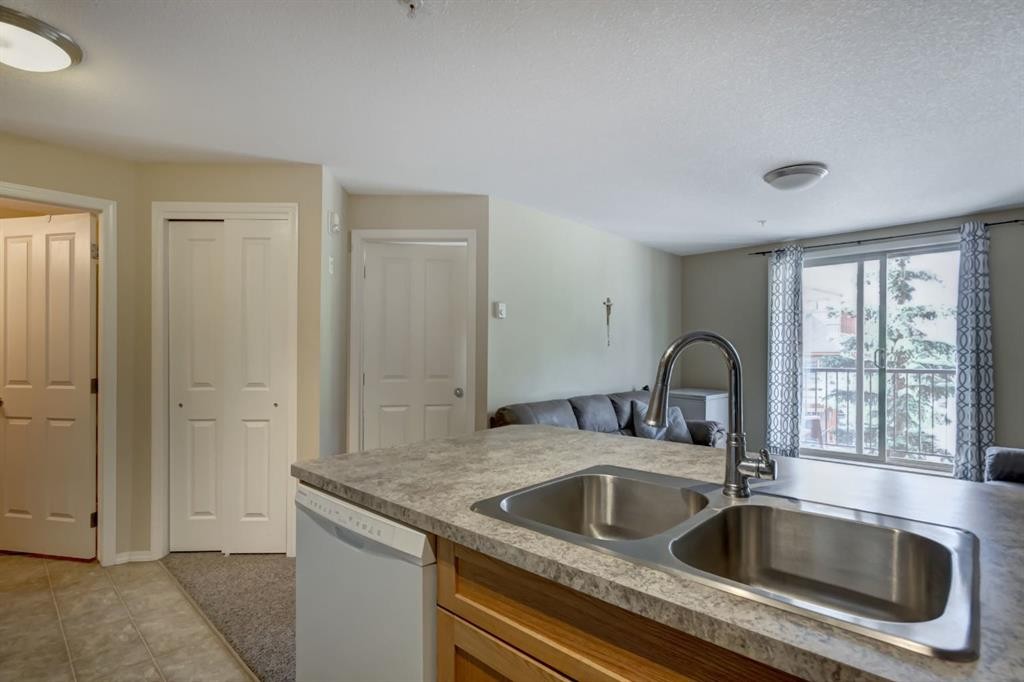 202-186 Kananaskis Way, Canmore, AB - Indoor Photo Showing Kitchen With Double Sink