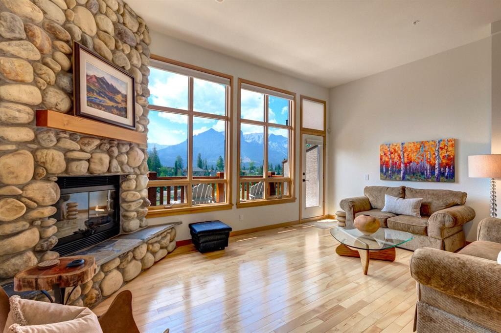 25-300 Eagle Terrace Road, Canmore, AB - Indoor Photo Showing Living Room With Fireplace