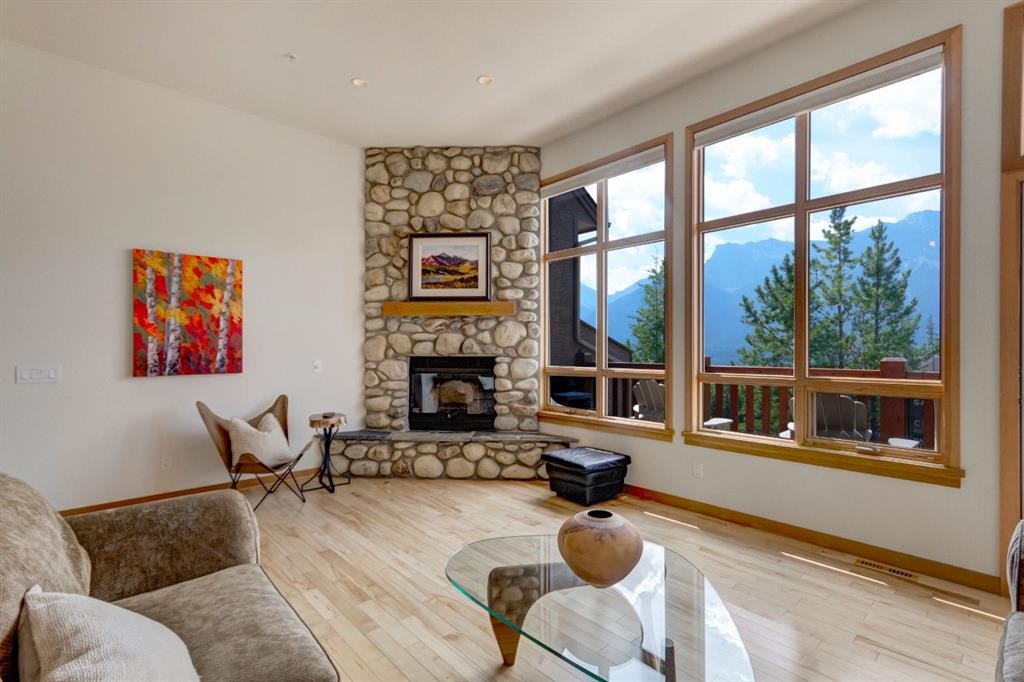 25-300 Eagle Terrace Road, Canmore, AB - Indoor Photo Showing Living Room With Fireplace