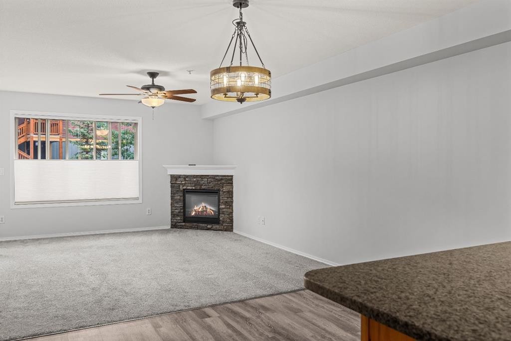 120-300 Palliser Lane, Canmore, AB - Indoor Photo Showing Living Room With Fireplace