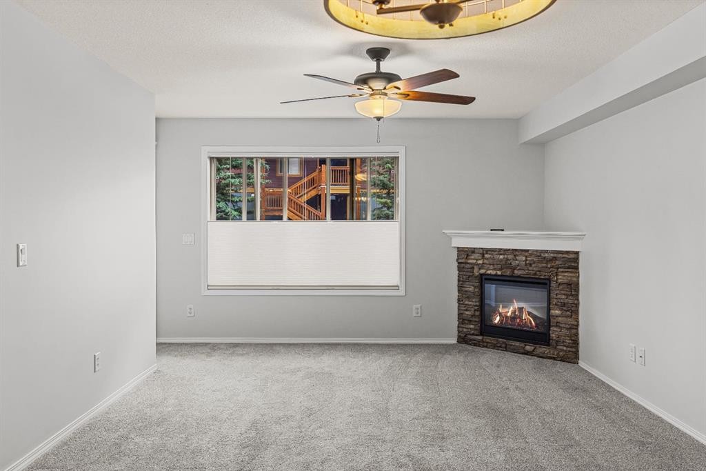 120-300 Palliser Lane, Canmore, AB - Indoor With Fireplace