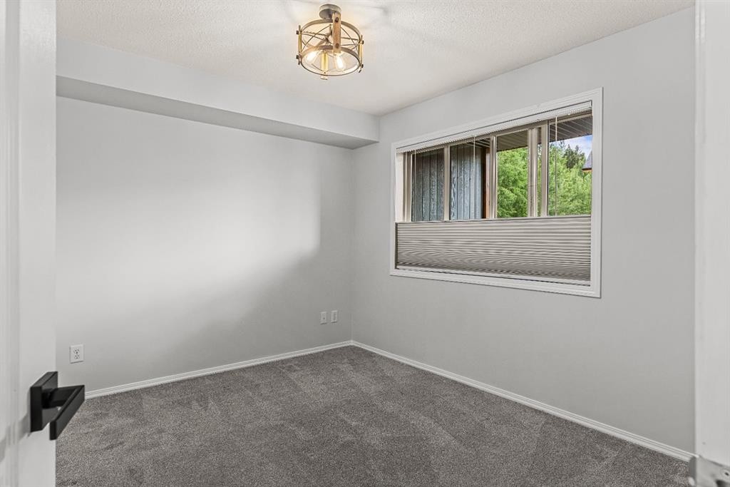 120-300 Palliser Lane, Canmore, AB - Indoor Photo Showing Other Room