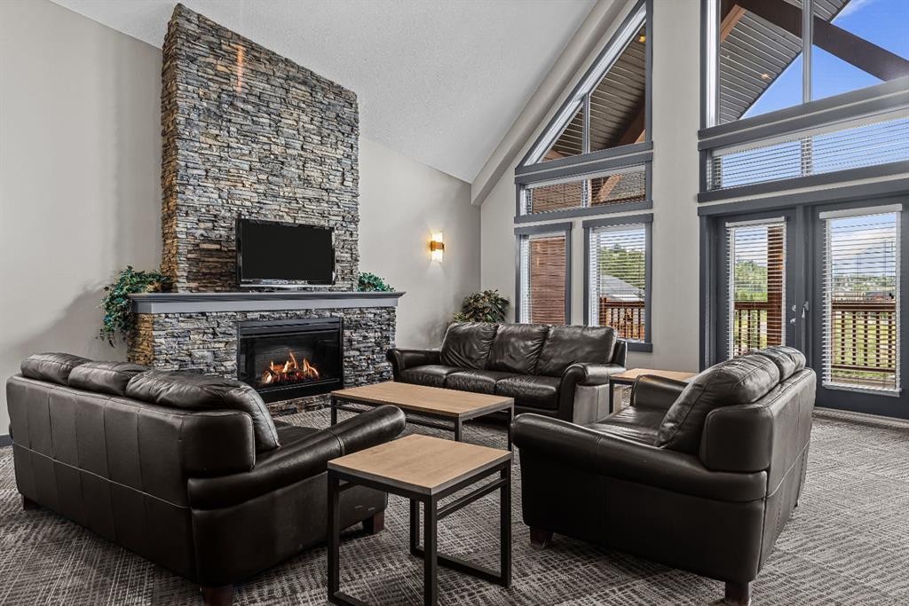 120-300 Palliser Lane, Canmore, AB - Indoor Photo Showing Living Room With Fireplace