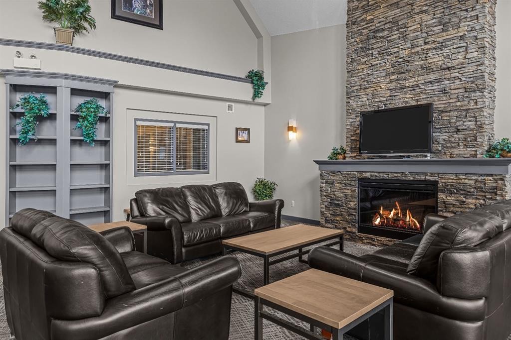 120-300 Palliser Lane, Canmore, AB - Indoor Photo Showing Living Room With Fireplace