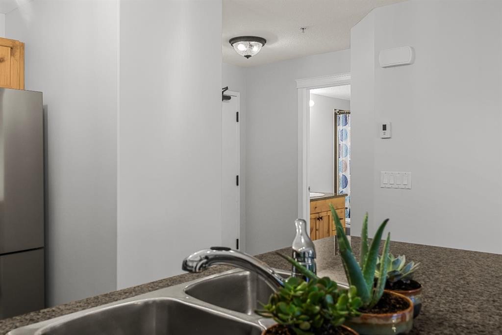 120-300 Palliser Lane, Canmore, AB - Indoor Photo Showing Kitchen With Double Sink