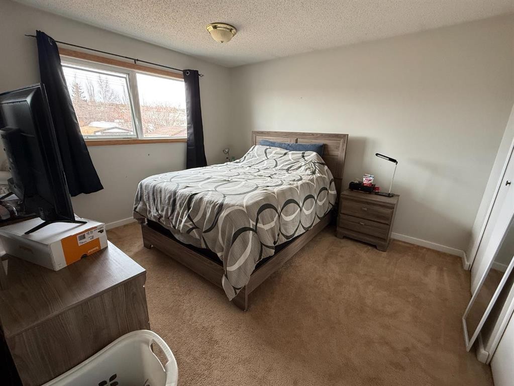 59 A&B Centennial Crescent, Swan Hills, AB - Indoor Photo Showing Bedroom