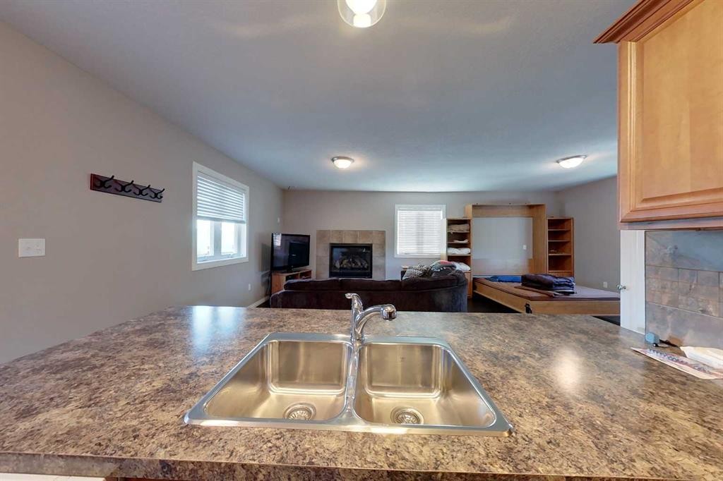 734041 Range Road, Wagner, AB - Indoor Photo Showing Kitchen With Fireplace With Double Sink