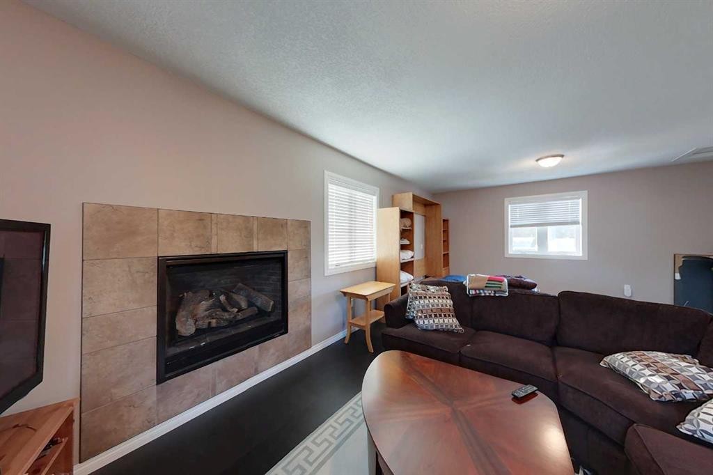 734041 Range Road, Wagner, AB - Indoor Photo Showing Living Room With Fireplace