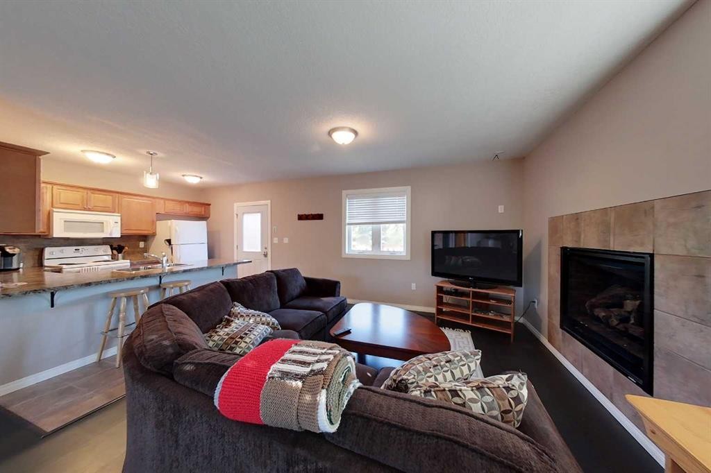 734041 Range Road, Wagner, AB - Indoor Photo Showing Living Room With Fireplace
