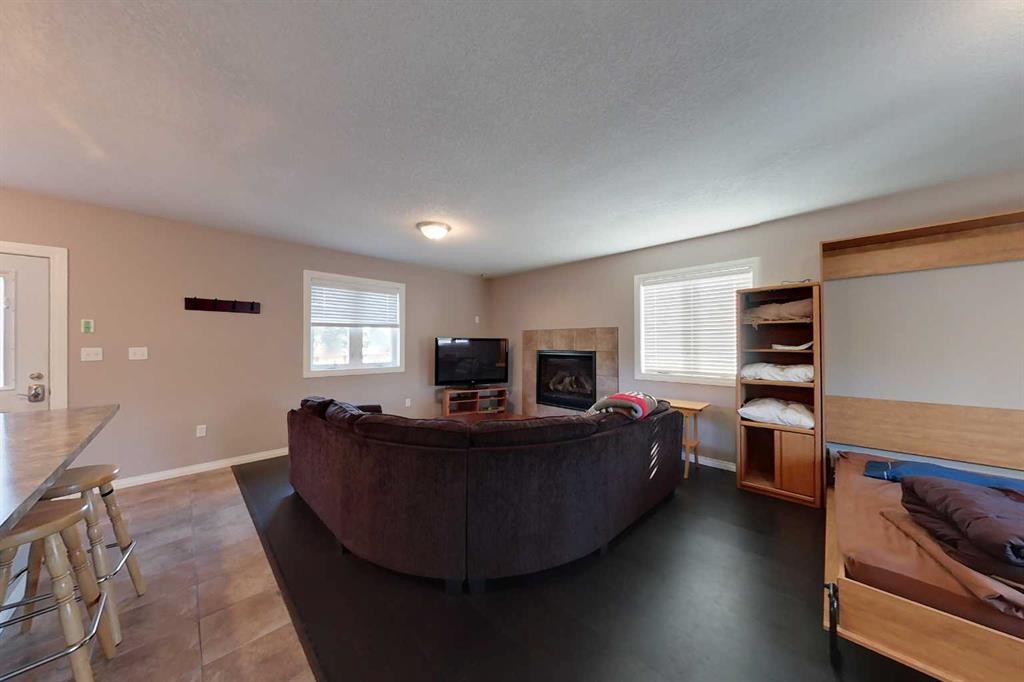 734041 Range Road, Wagner, AB - Indoor Photo Showing Living Room With Fireplace