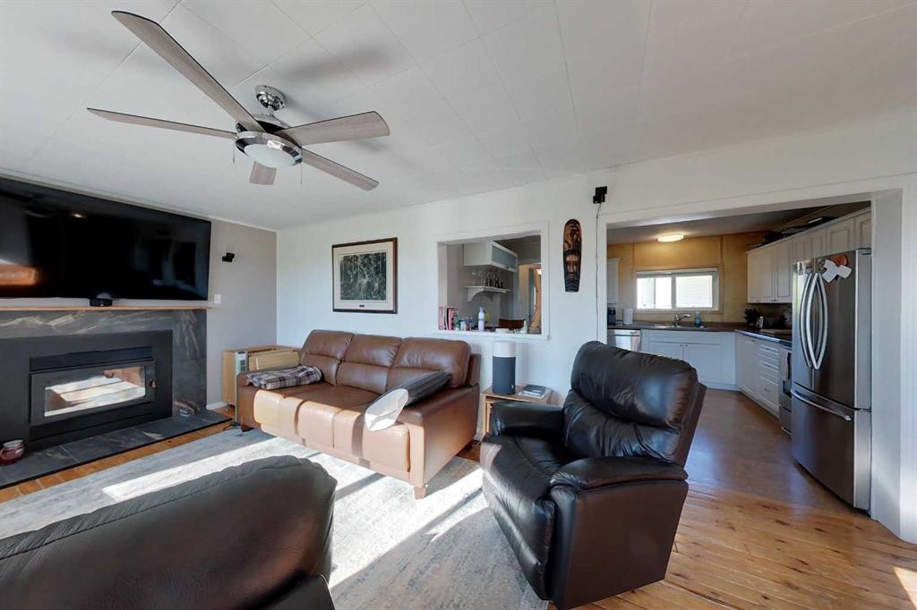 734041 Range Road, Wagner, AB - Indoor Photo Showing Living Room With Fireplace