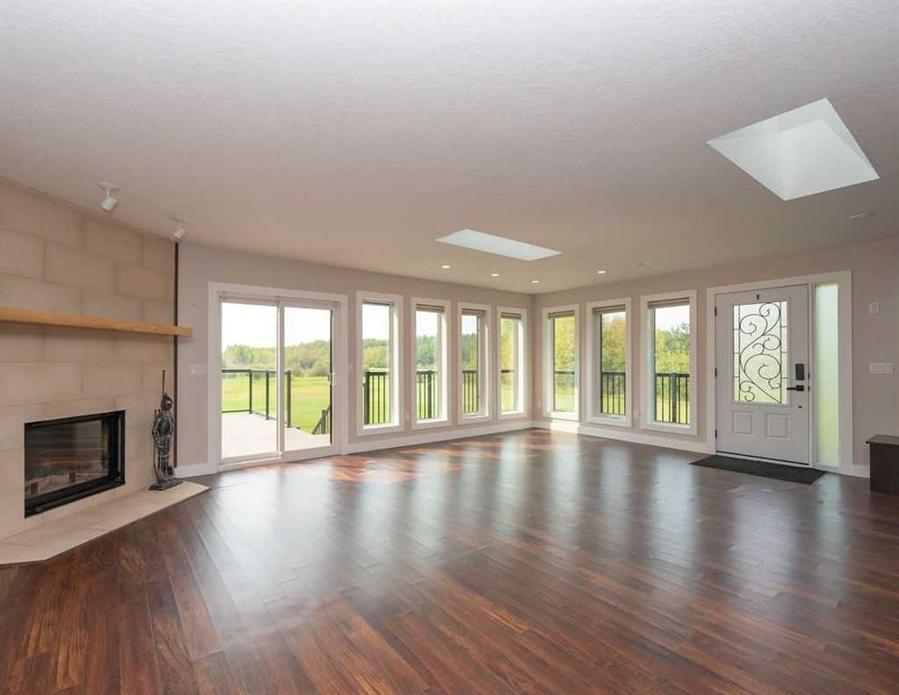 655059 Highway 813, Rural Athabasca County, AB - Indoor Photo Showing Living Room With Fireplace