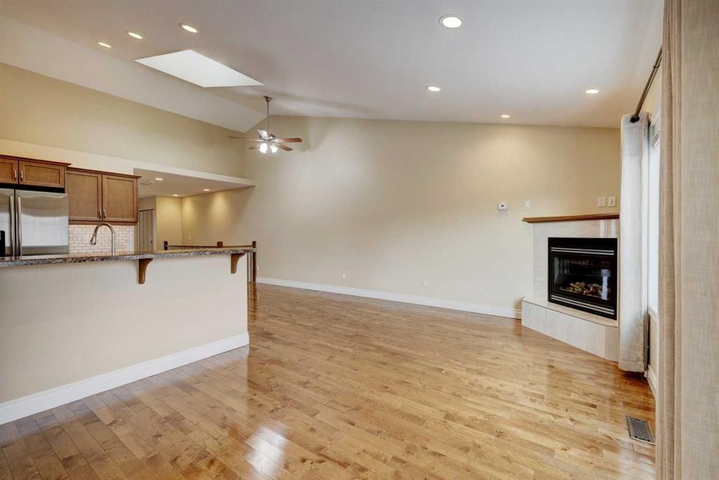 24 Garden Way, Drumheller, AB - Indoor Photo Showing Kitchen With Fireplace