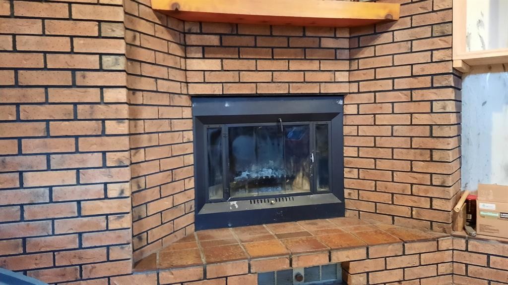 706 Bankview Close, Drumheller, AB - Indoor Photo Showing Other Room With Fireplace