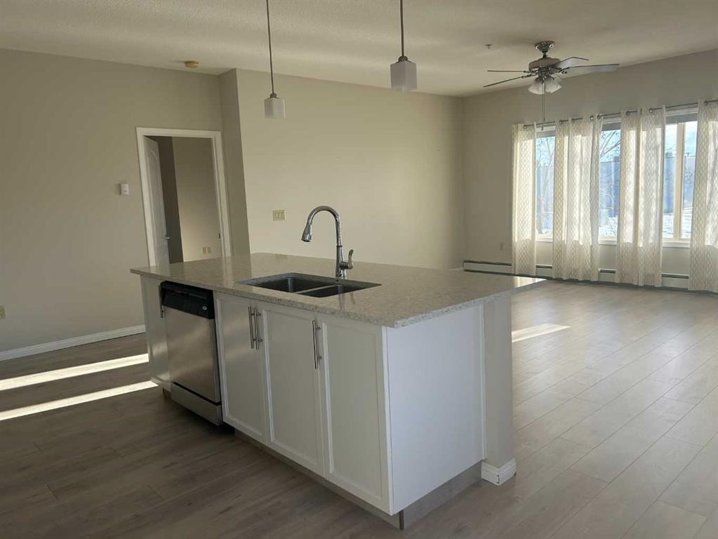 202-4403 67A Avenue, Olds, AB - Indoor Photo Showing Kitchen With Double Sink