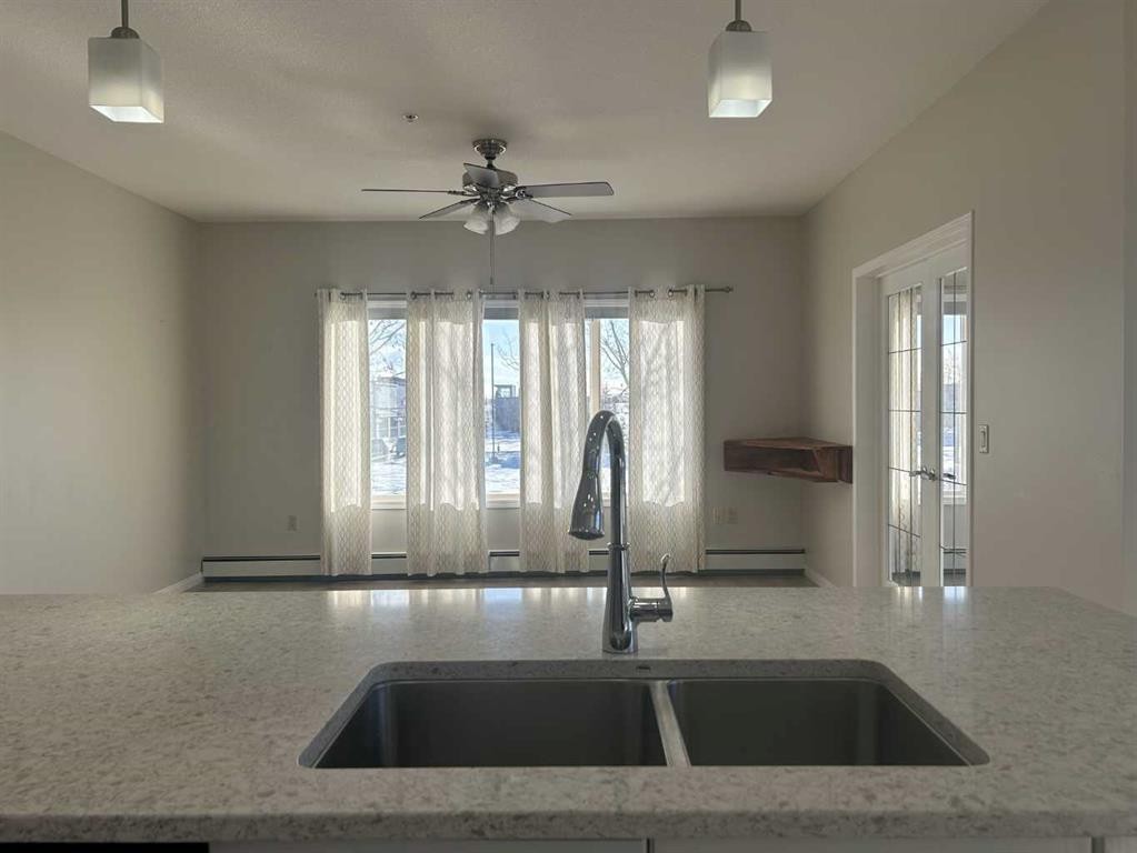 202-4403 67A Avenue, Olds, AB - Indoor Photo Showing Kitchen With Double Sink