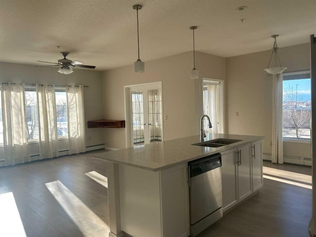 202-4403 67A Avenue, Olds, AB - Indoor Photo Showing Kitchen With Double Sink