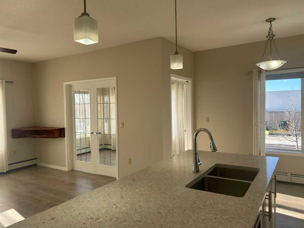 202-4403 67A Avenue, Olds, AB - Indoor Photo Showing Kitchen With Double Sink