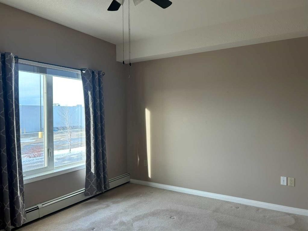202-4403 67A Avenue, Olds, AB - Indoor Photo Showing Other Room