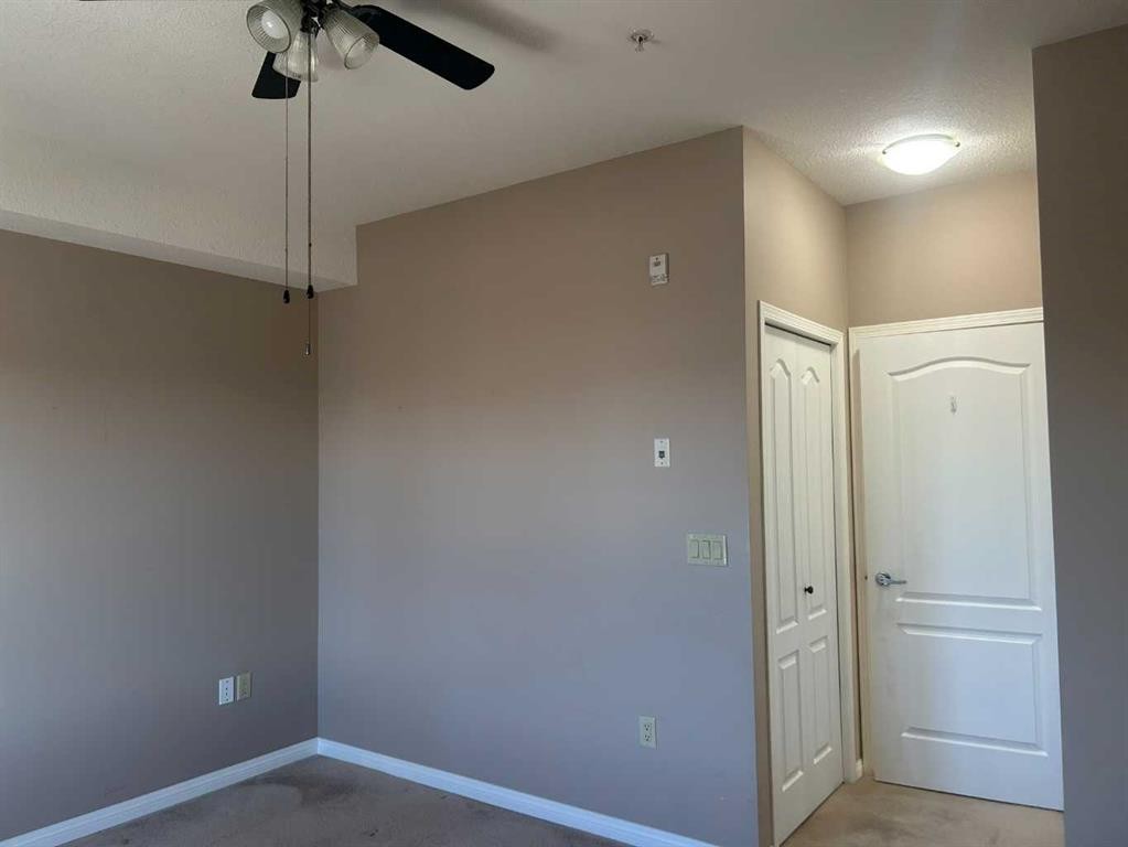 202-4403 67A Avenue, Olds, AB - Indoor Photo Showing Other Room