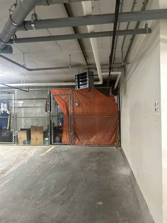 202-4403 67A Avenue, Olds, AB - Indoor Photo Showing Garage