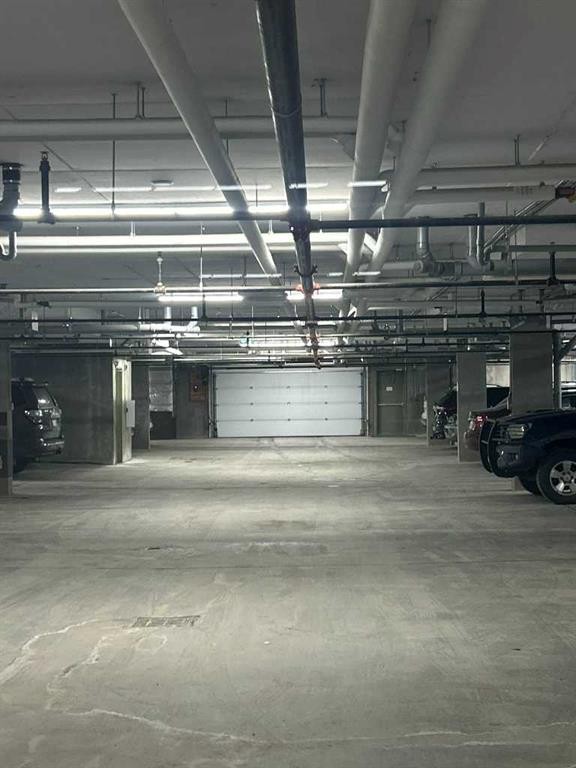 202-4403 67A Avenue, Olds, AB - Indoor Photo Showing Garage