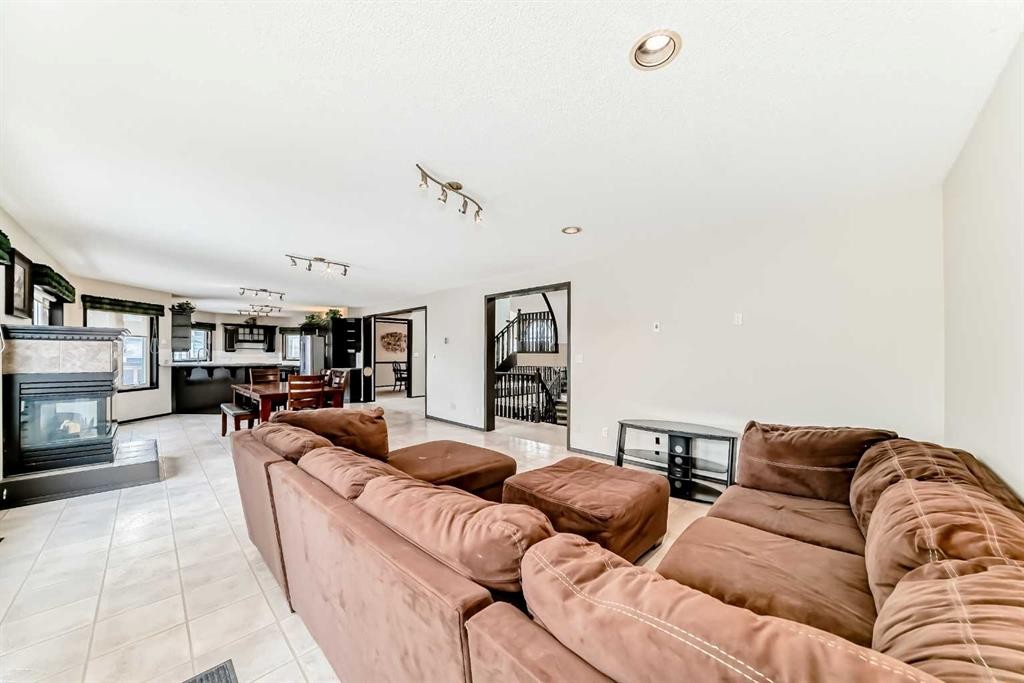 5 Chinook Crescent, Beiseker, AB - Indoor Photo Showing Living Room With Fireplace