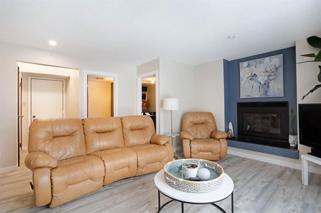 5 Fairview Crescent East, Brooks, AB - Indoor Photo Showing Living Room With Fireplace