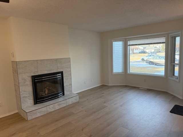 830 Birchwood Close, Drumheller, AB - Indoor Photo Showing Living Room With Fireplace