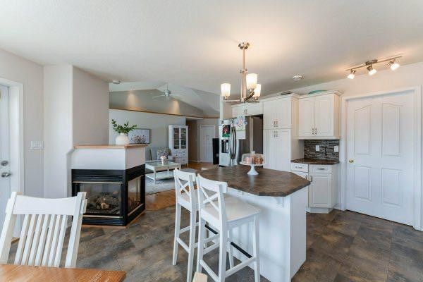 85 Michichi Drive, Drumheller, AB - Indoor Photo Showing Kitchen With Fireplace