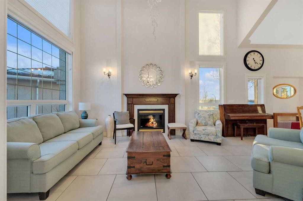 25 Ashmore Close, Red Deer, AB - Indoor Photo Showing Living Room With Fireplace