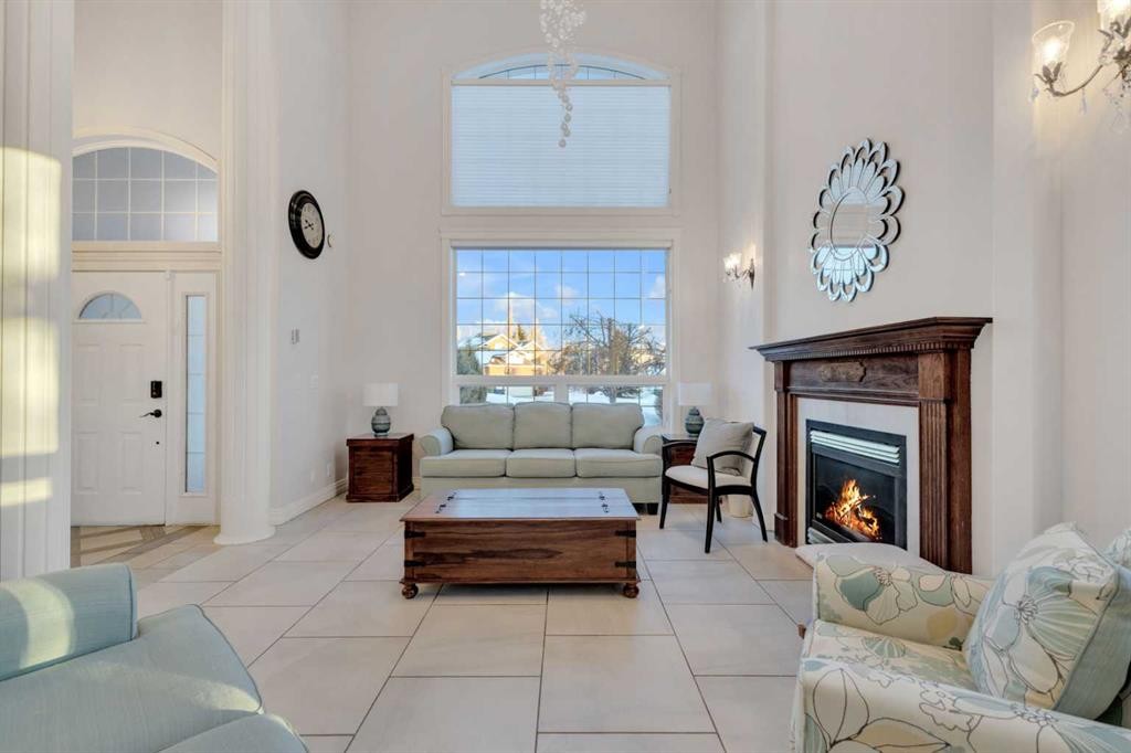 25 Ashmore Close, Red Deer, AB - Indoor Photo Showing Living Room With Fireplace