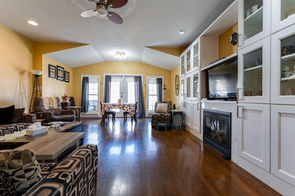 145 Centre Street, Drumheller, AB - Indoor Photo Showing Living Room With Fireplace