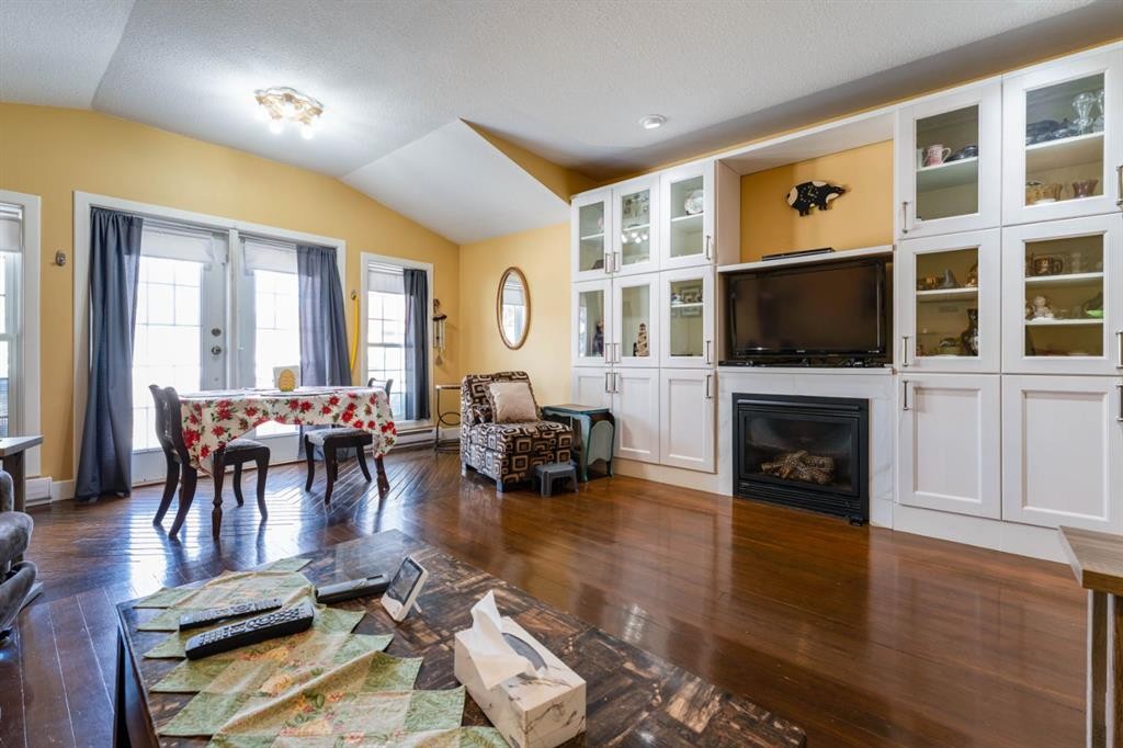 145 Centre Street, Drumheller, AB - Indoor Photo Showing Living Room With Fireplace