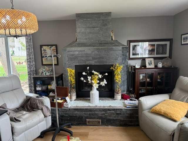 148 4 Street, Drumheller, AB - Indoor Photo Showing Living Room With Fireplace