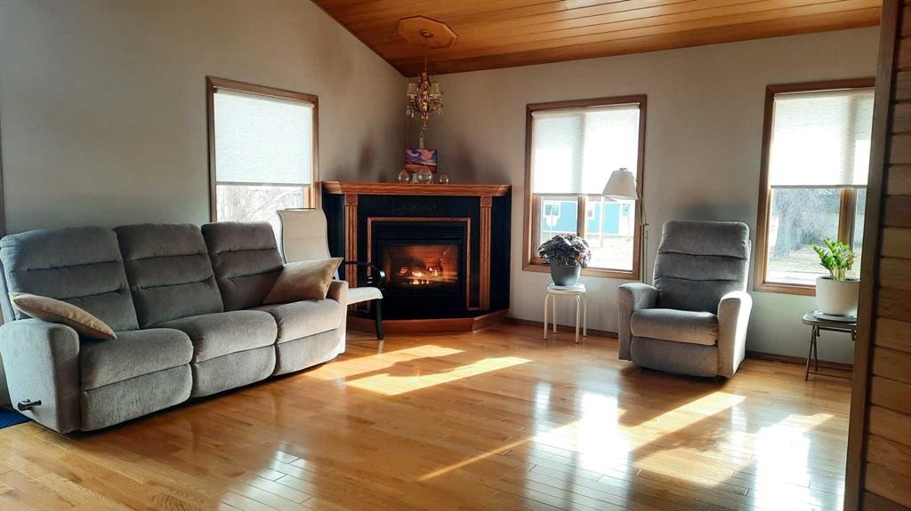 241 4 Street, Drumheller, AB - Indoor Photo Showing Living Room With Fireplace