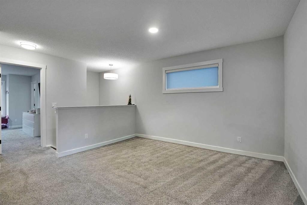 44 Seton Villas Se, Calgary, AB - Indoor Photo Showing Other Room