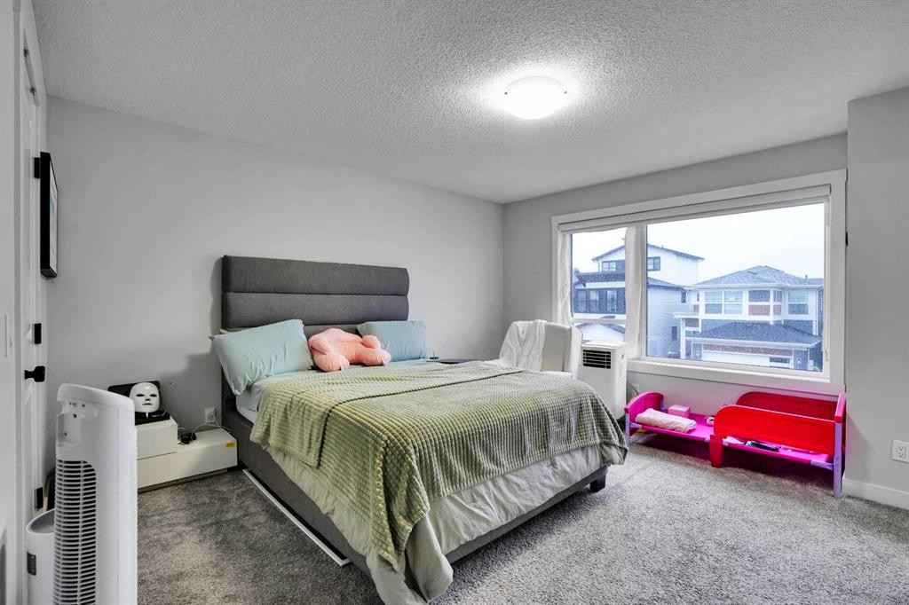 44 Seton Villas Se, Calgary, AB - Indoor Photo Showing Bedroom