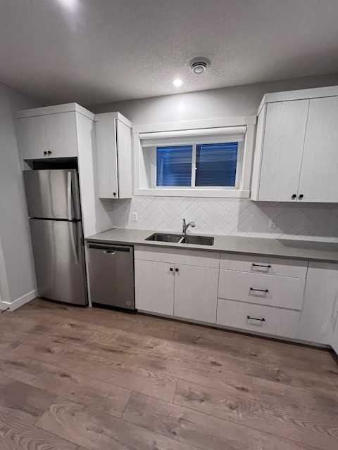 44 Seton Villas Se, Calgary, AB - Indoor Photo Showing Kitchen With Double Sink