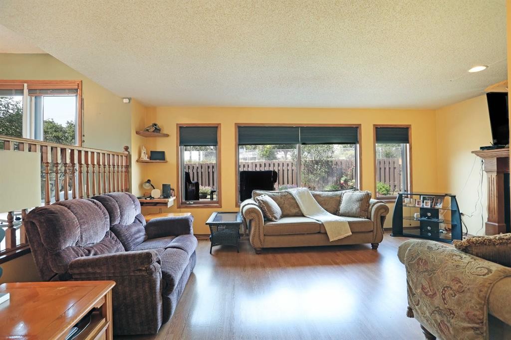 35 Parkland Close East, Brooks, AB - Indoor Photo Showing Living Room With Fireplace