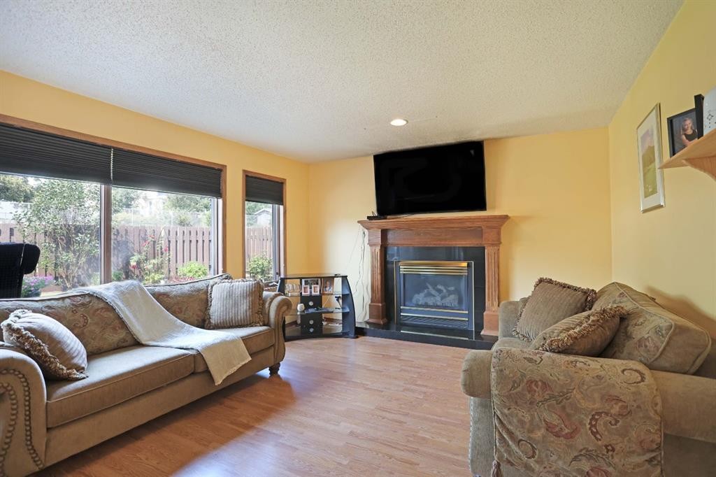 35 Parkland Close East, Brooks, AB - Indoor Photo Showing Living Room With Fireplace