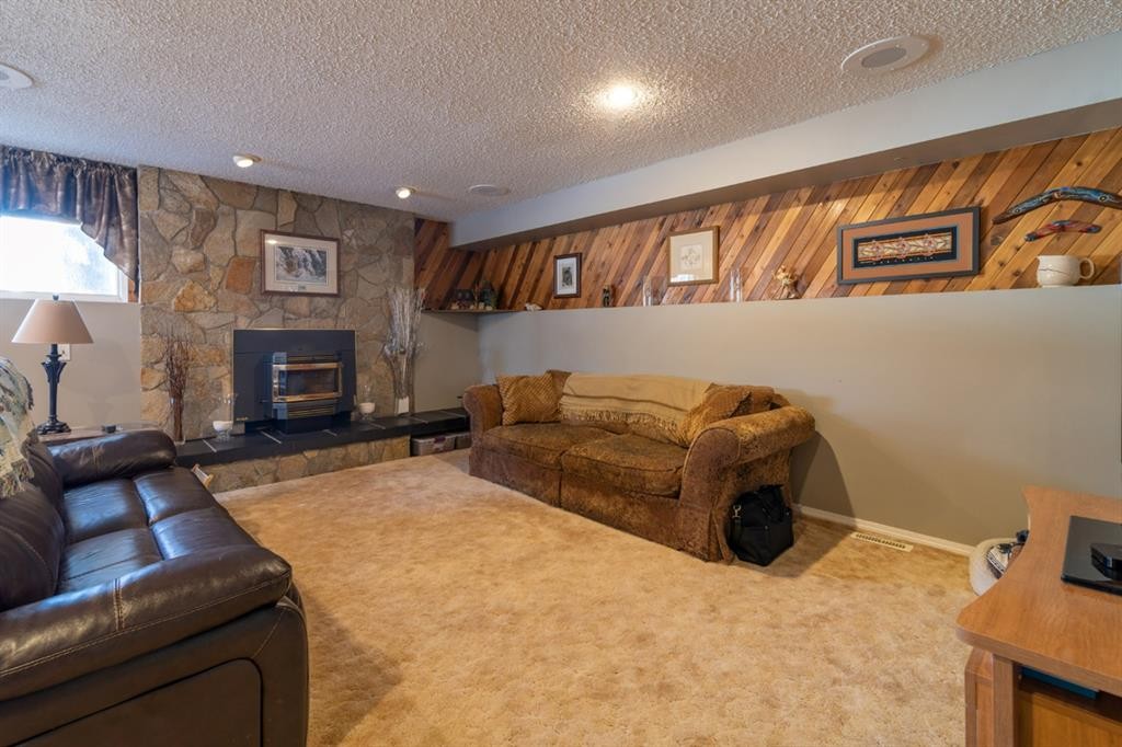 517 2 Street Crescent, Wainwright, AB - Indoor Photo Showing Living Room With Fireplace