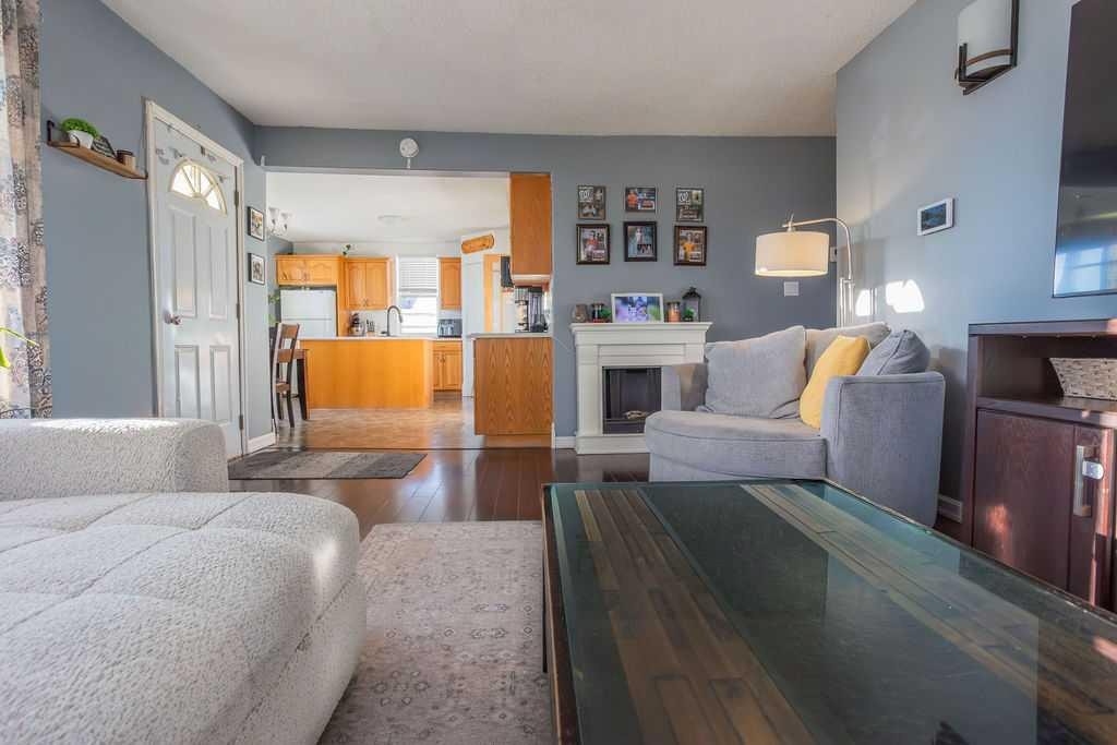 502 5 Avenue, Wainwright, AB - Indoor Photo Showing Other Room With Fireplace