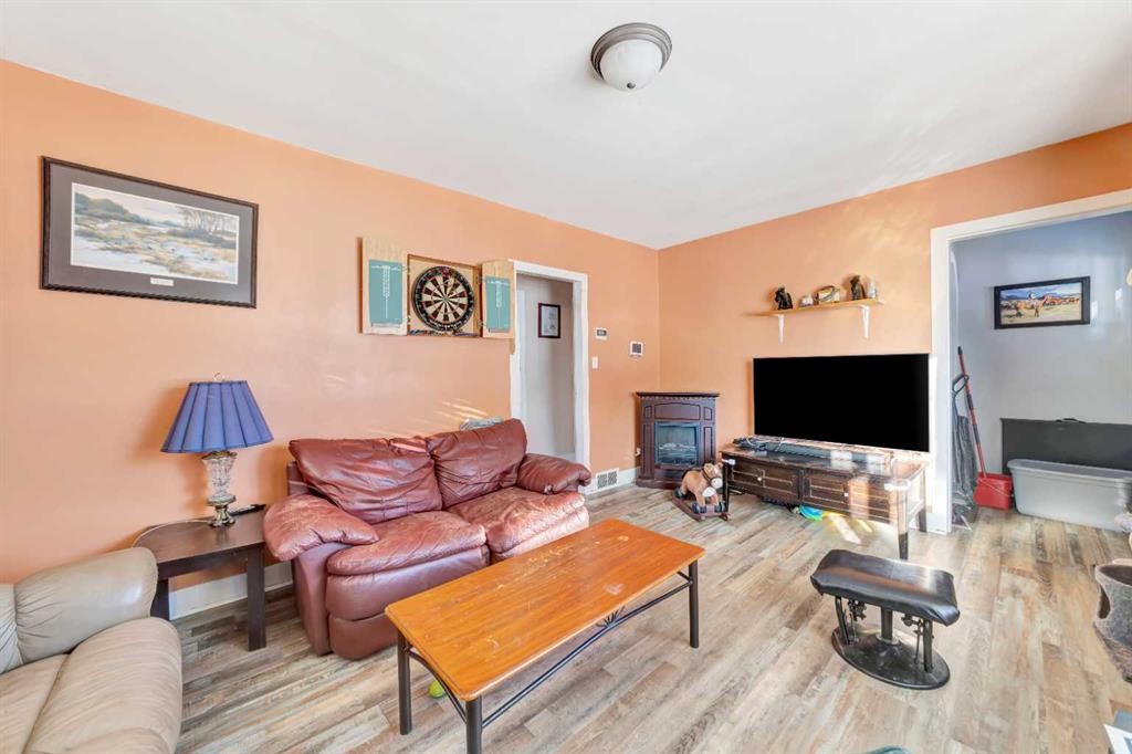 202 1 Street East, Lashburn, SK - Indoor Photo Showing Living Room With Fireplace