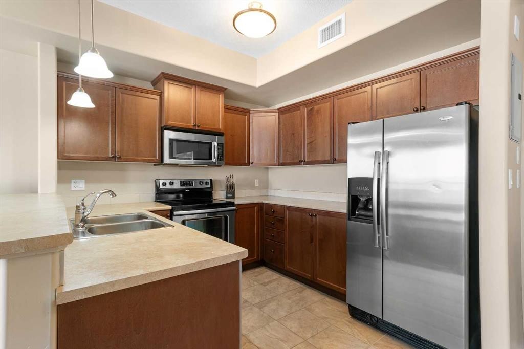 319-4102 69 Avenue, Lloydminster, AB - Indoor Photo Showing Kitchen With Double Sink